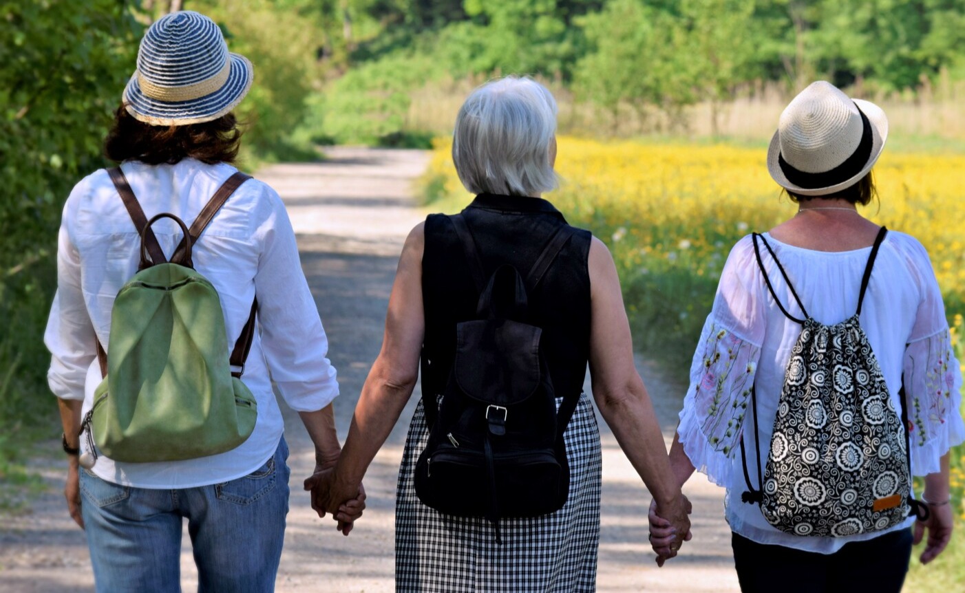 3 Womens Minsitry Members Holding Hands on Walk