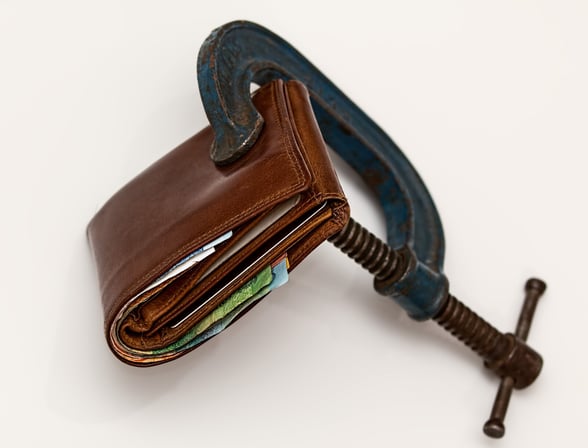 A C-Clamp Pinching a Wallet - School Budgets