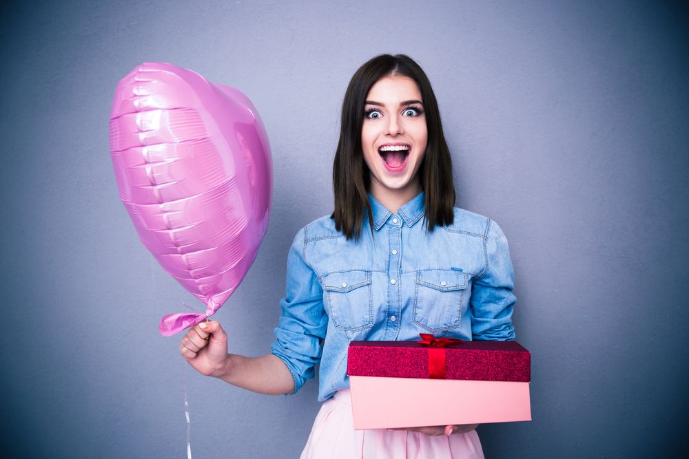 Woman with Balloon & Gift - Year End Giving for Churches