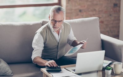 man looking at financial information