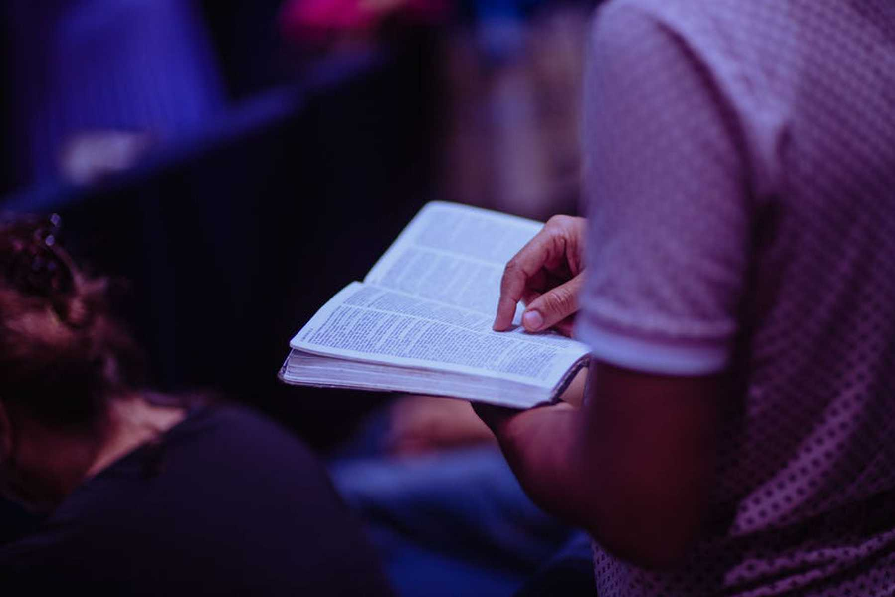 Chuch Member Reading a Benediction in Pew