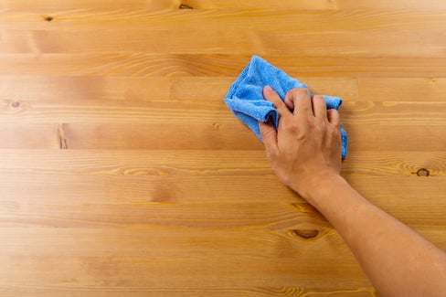 Cleaning table by hand
