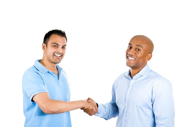 Smiling Pastor & Member Shaking Hands