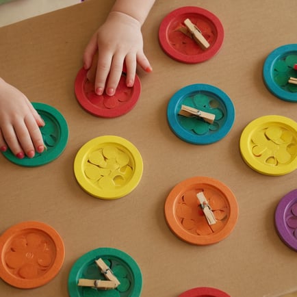 Clothespin Color Matching Activity for Preschool Girl in Small Group