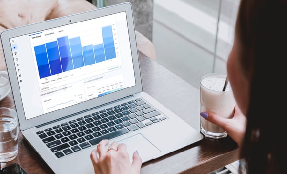 Daycare provider analyzing data on computer