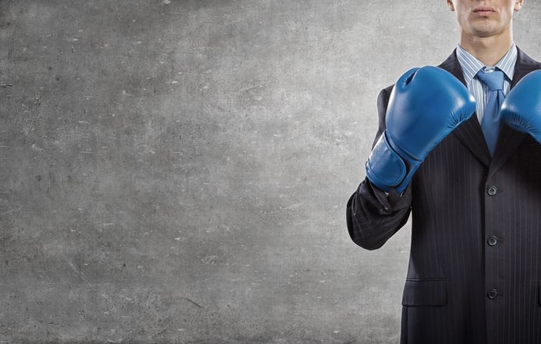 Business Man with Boxing Gloves - Church Conflict Blog