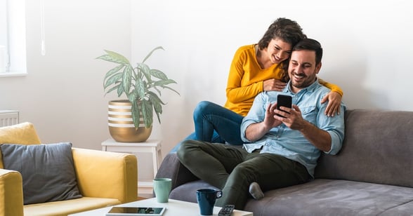 Couple Donating Online to Church