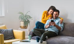 couple looking at mobile phone