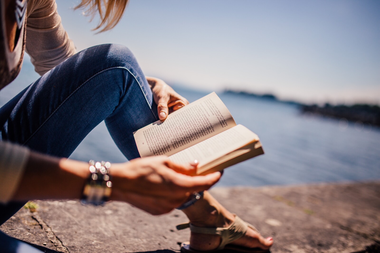 Girl Reading on a Dock