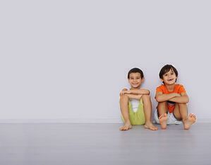 Happy two little boys sitting on floor at home, large copy space-1
