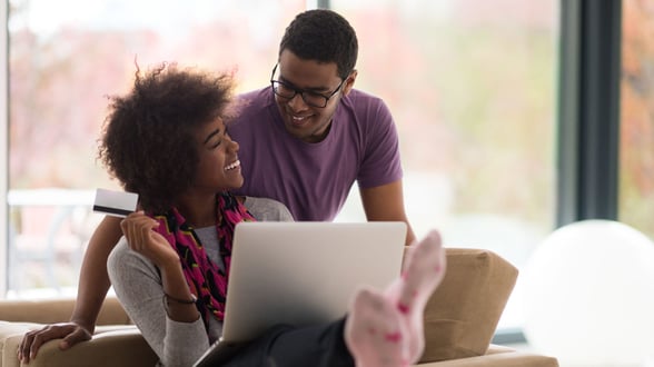 Couple making church donation online