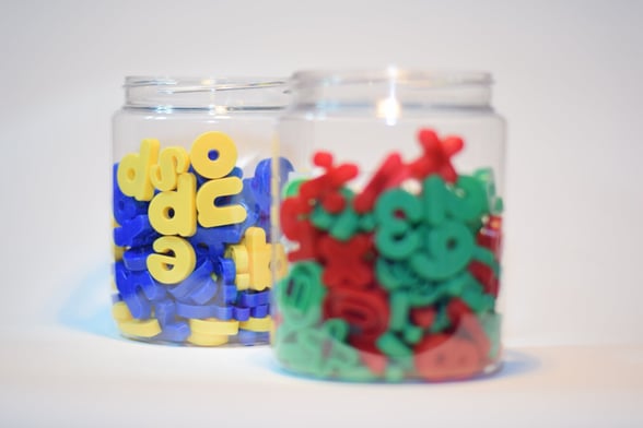 Jar of alphabet toys for preschoolers doing transition activities