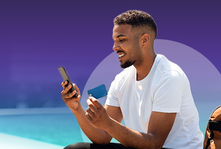 Man-holds-credit-card-and-phone