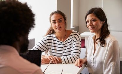 family talking to staff member