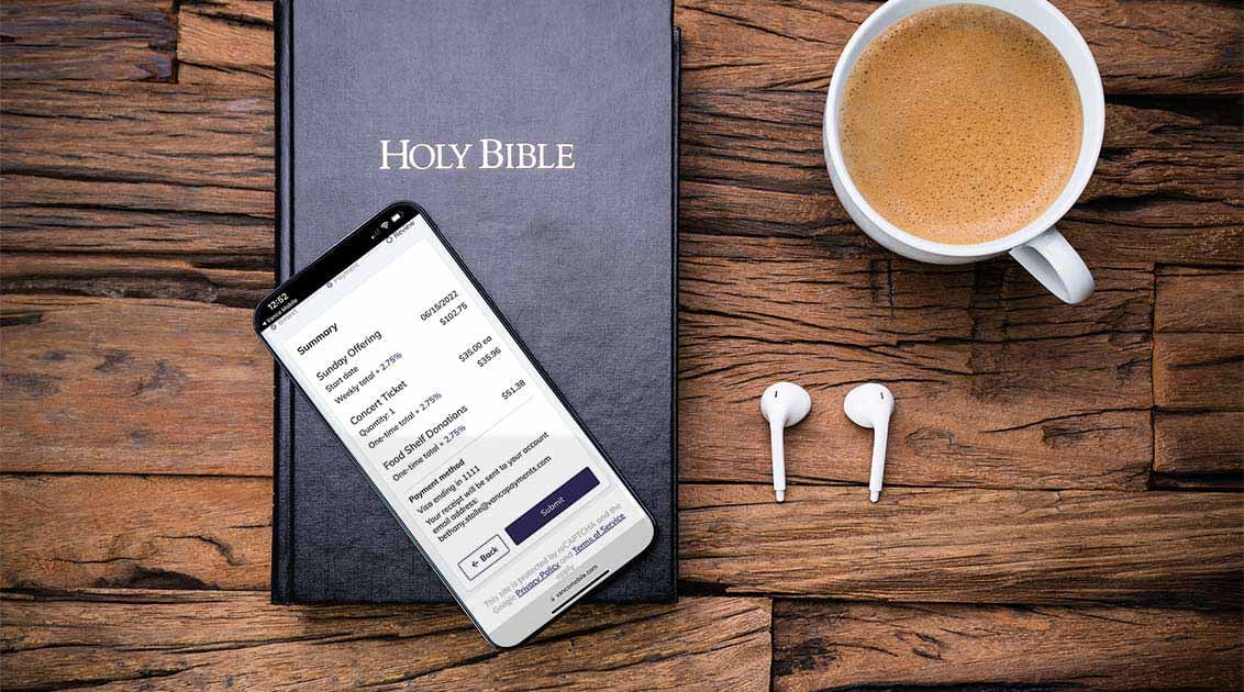 vanco mobile phone on bible