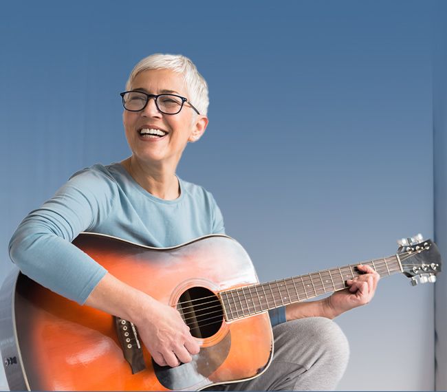 older-woman-playing-guitar