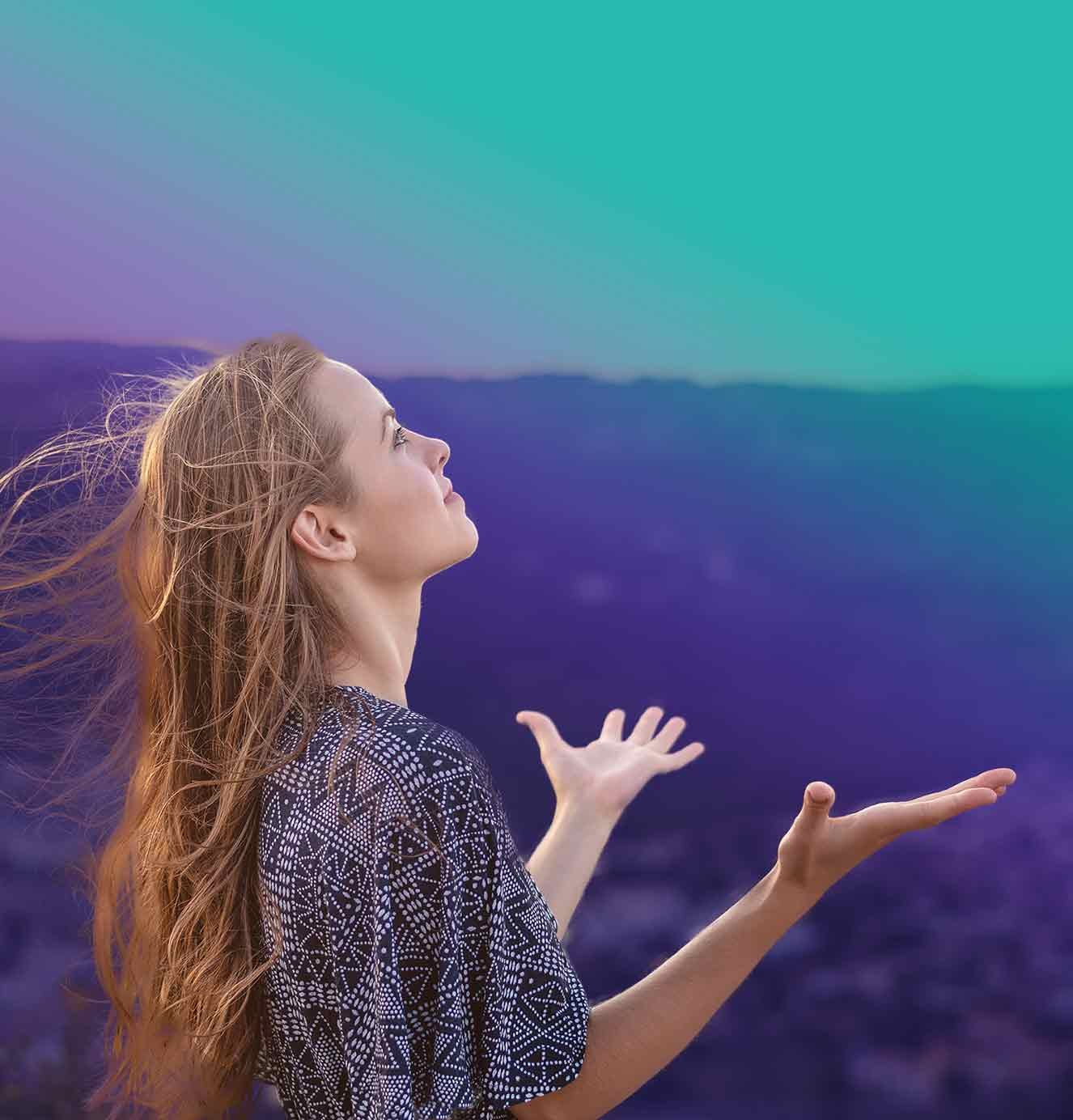 woman reaching to the sky