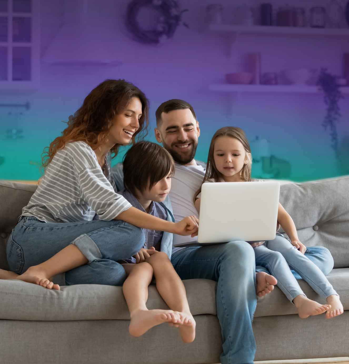 family on couch with laptop