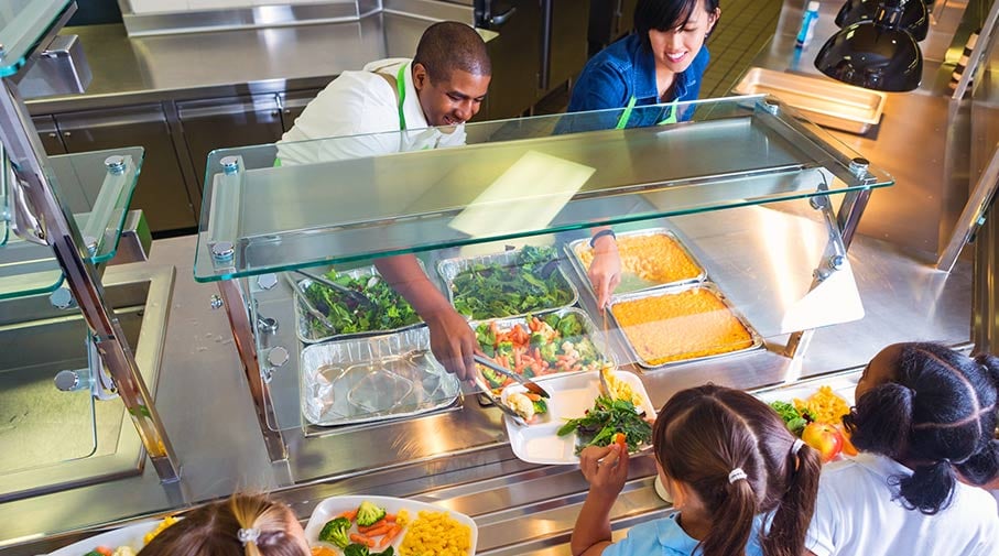 students in school cafeteria line