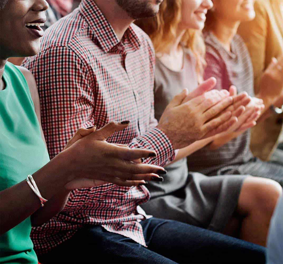 people clapping at event