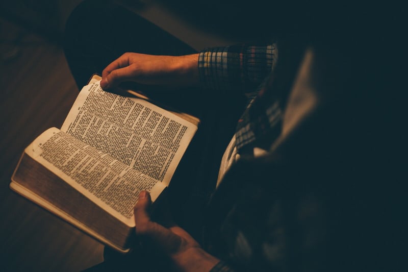 Man holding Bible - Ice Breaker Game Blog