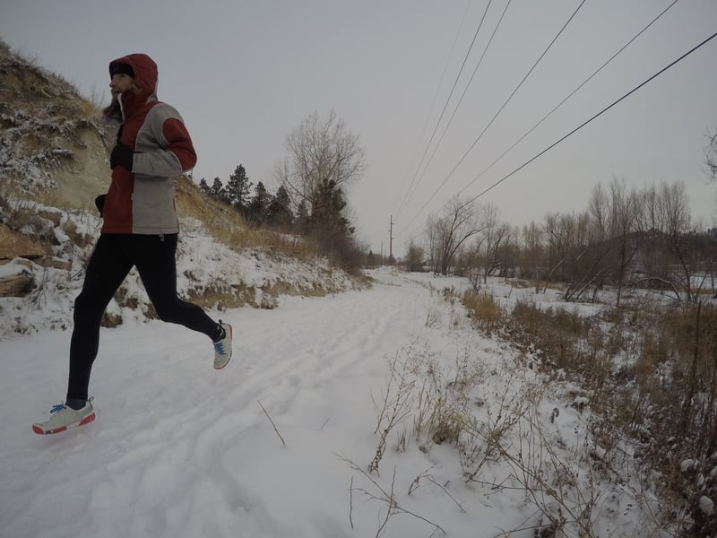 Man in winter gear doing a holiday fun run