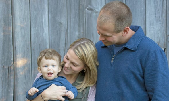 Parents holding young toddler