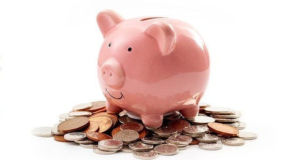 Piggy Bank on top of coins - Church Pledge Drives