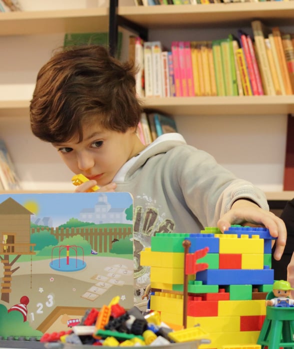 Preschool Boy Doing Activity with Lego Blocks