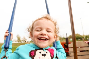 Image of Preschool student playing outdoors