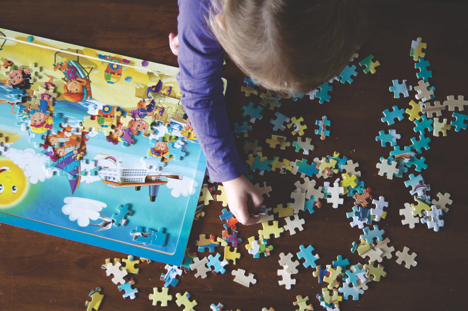 Preschool student playing with a puzzle