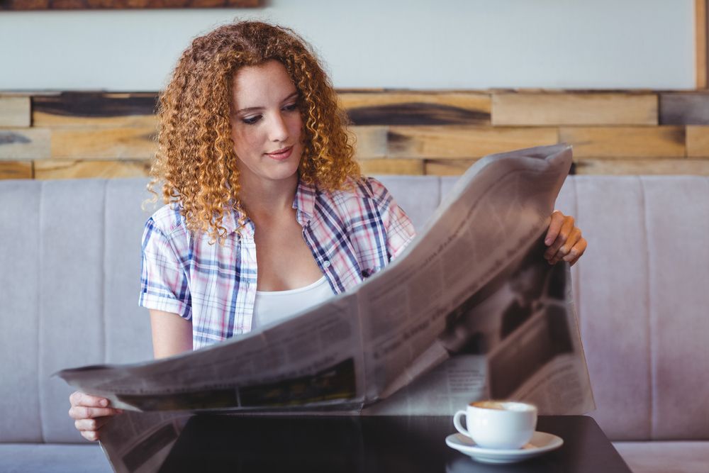 Church Marketing Strategies- Woman with Newspaper