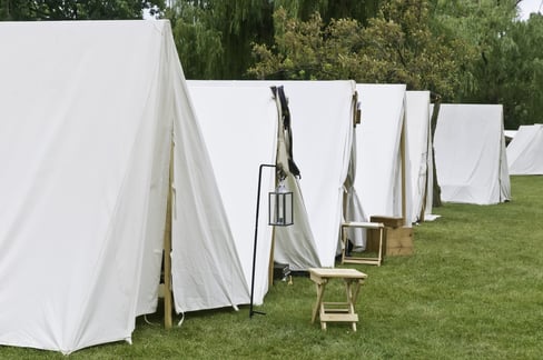 Row of white tents in Union camp at reenactment of American Civil War (1861-1865), Four Seasons Park, Lombard, Illinois, on July 27, 2013. Typically, the volunteer actors sleep in such tents at night.