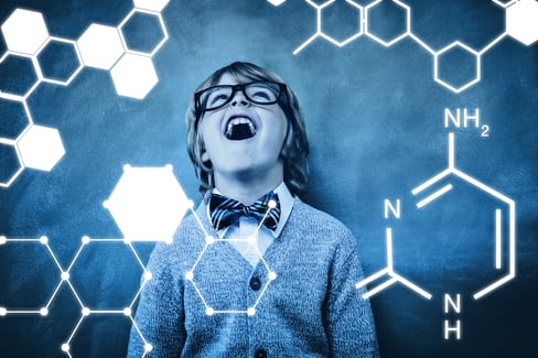Science graphic against boy laughing in front of blackboard