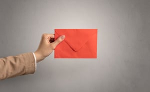 A Hand Holding a Stewardship Letter for Churches