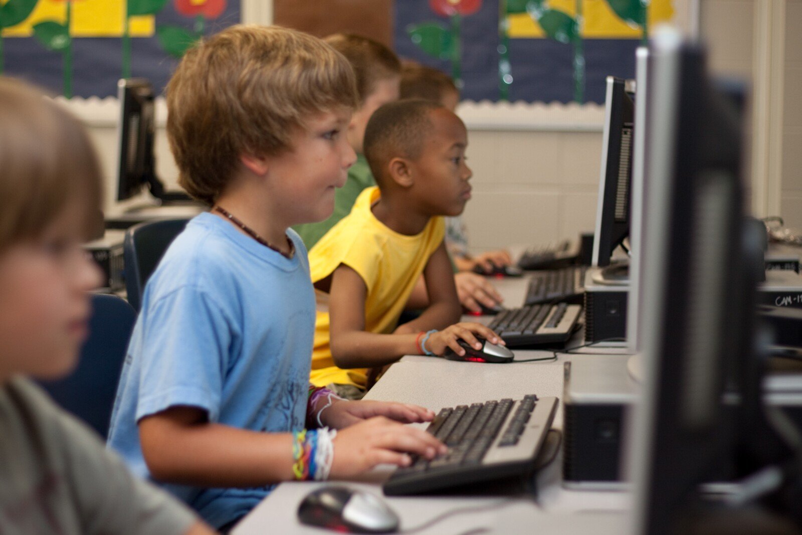 Students playing online learning games at school