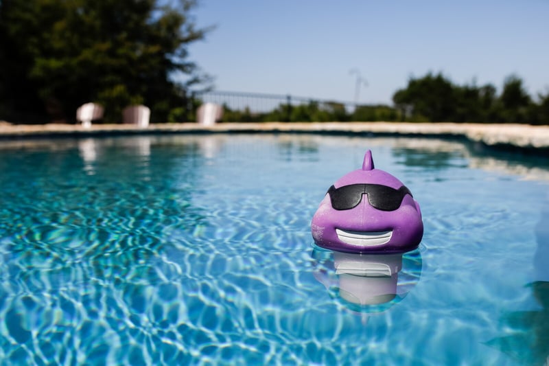 Summer pool with purple dinosaur floatie