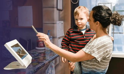 teacher showing kid technology