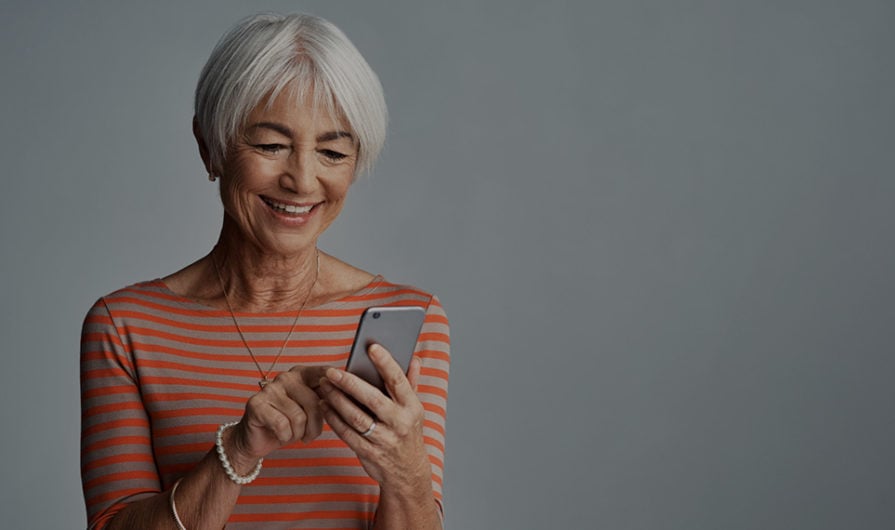 Woman on Phone Giving to Her Church Online