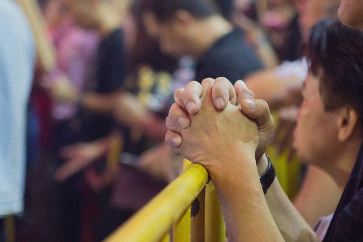 Volunteer Praying at Church