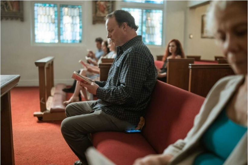 Welcome Messages for Church Visitors - Man Reading in Pew