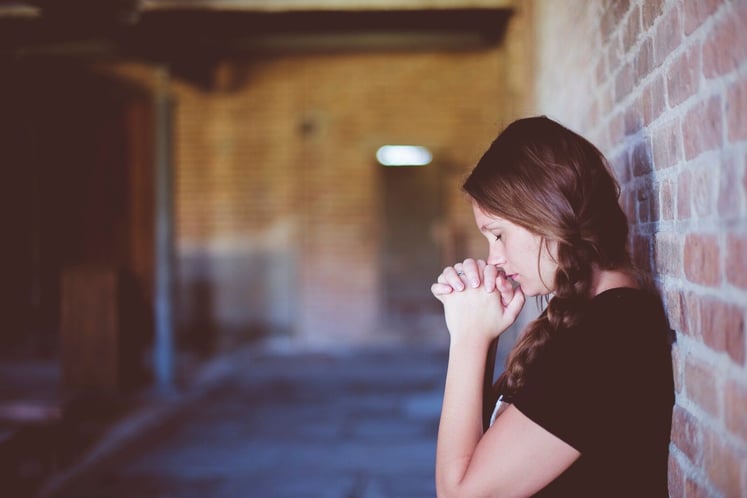 Woman Giving a Closing Prayer Outside Church