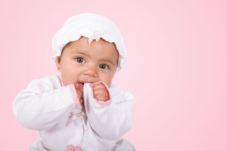 beautiful baby over pink background