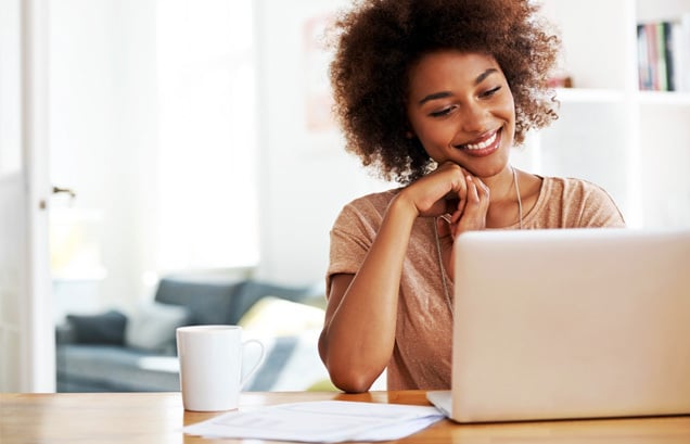 happy-woman-working-laptop