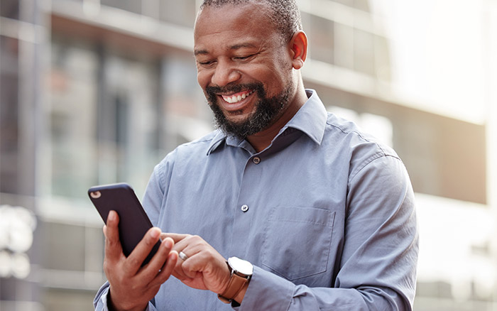 man-smiling-at-phone