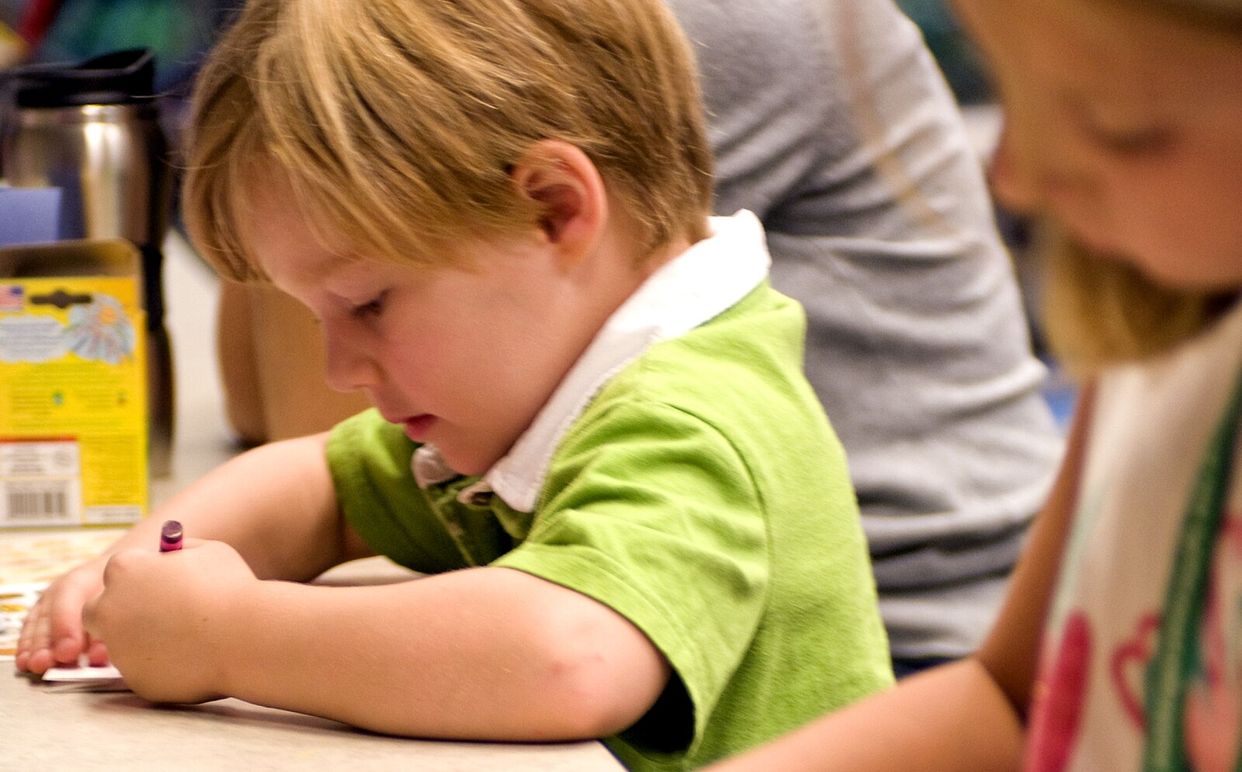 childcare boy and girl coloring