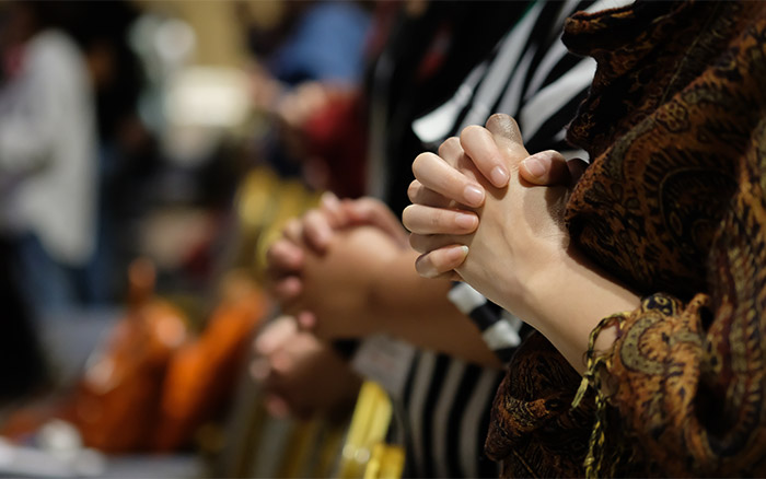 people-praying-with-hands-clasped
