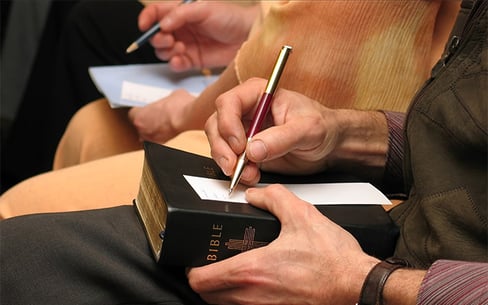 Image of writing letters on bible