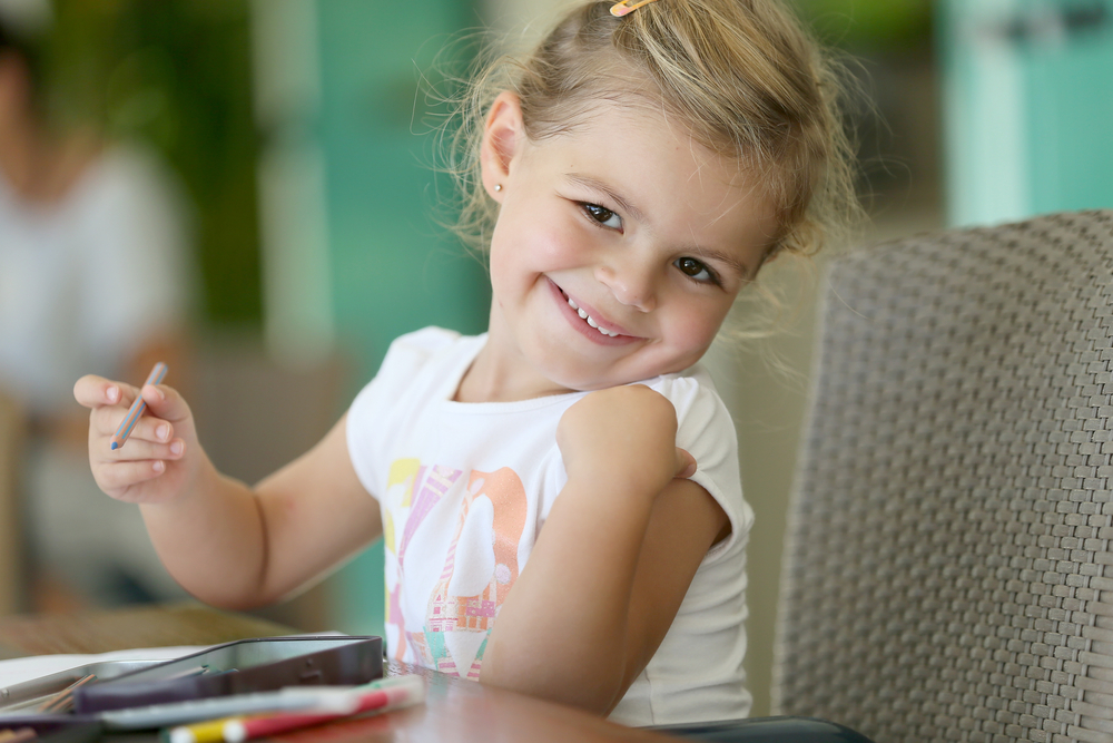 Cute little girl making drawings