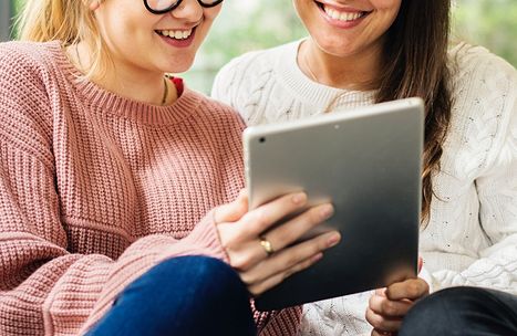 childcare workers with tablet